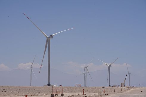 A group of wind turbines in a desert. Development - Inter-American Development Bank - IDB