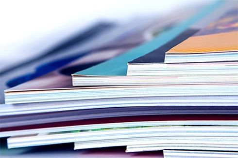 A stack of magazines on a white background. Knowledge - Inter-American Development Bank - IDB