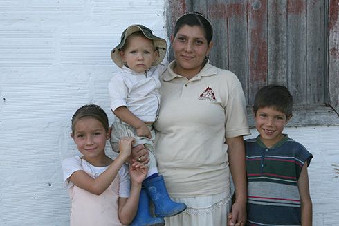 a person and children posing for a picture