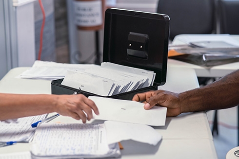 A person handing over a document