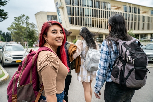 a group of people walking on a street Gender Equity - Inter-American Development Bank - IDB