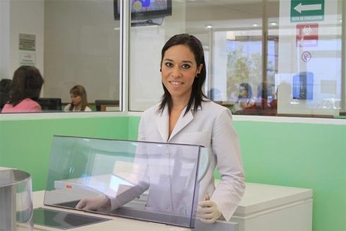 A woman in a lab coat. Health - Inter-American Development Bank - IDB