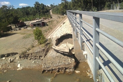 A broken bridge over a river - Inter-American Development Bank - IDB