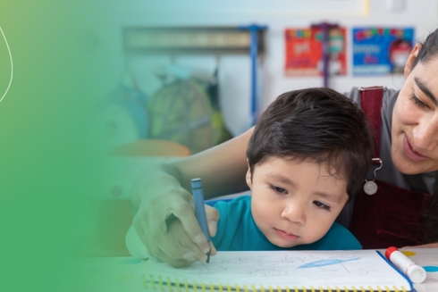 A boy and his mother drawing in a book. Sustainable - Inter-American Development Bank - IDB