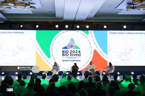 People sitting on a stage participating in a panel discussion at the BID 2024 - Sustainable Development - Inter-American Development Bank - IDB