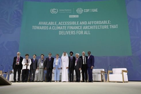 A group of dignitaries standing on stage at a United Nations Climate Change conference - Economic Development - Inter-American Development Bank - IDB