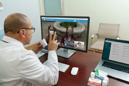 Men watching a monitor - Financial Development - Inter American Development Bank - IDB