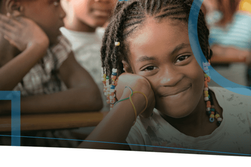 Girl smiling at the classroom - Project Evaluation Portal - Inter American Development Bank - IDB