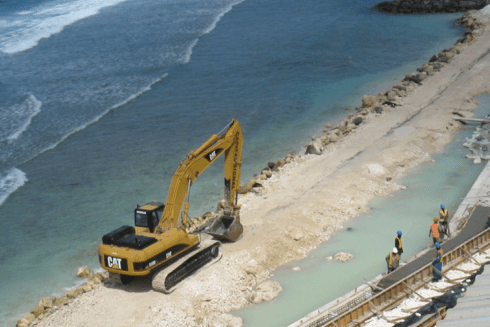 Tractor on sand and sea - Inter American Development Bank - IDB Environmental and Social Solutions