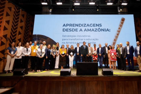 People standing on the stage of a theater or conference hall - Inter American Development Bank - Amazonia