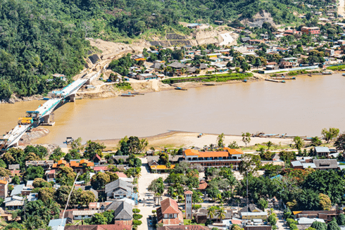 Aerial view of river and its surrounding village of houses in Amazonas - Inter American Development Bank - Amazonia
