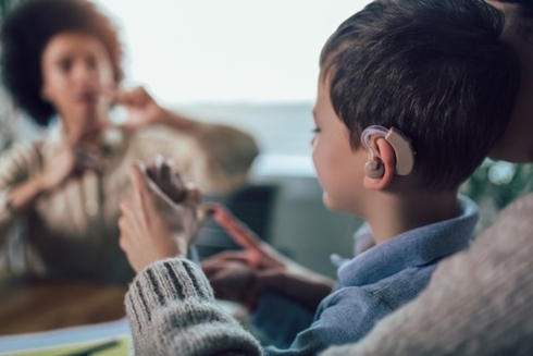 A child using an assisted hearing device - Inclusion of people with disabilities - Inter American Development Bank - IDB