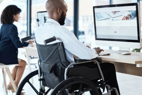 Man in wheelchair working - Inclusion of people with disabilities - Inter American Development Bank - IDB