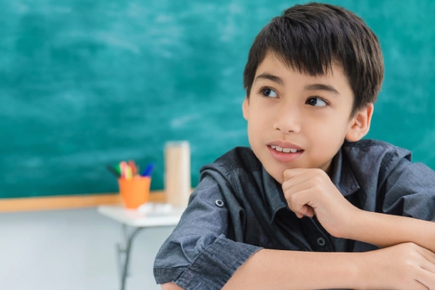 Child thinking on a classroom - Education - Inter American Development Bank - IDB