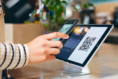 Hands of a person touching a mobile electronic tablet - Inter American Development Bank - Research