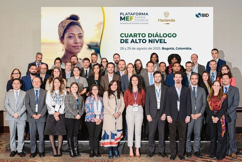 People standing in auditorium posing for photo - Inter American Development Bank - Climate Change