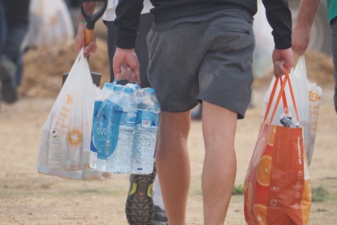 Man taking some plastic bags - Disaster Risk - Inter American Development Bank - IDB