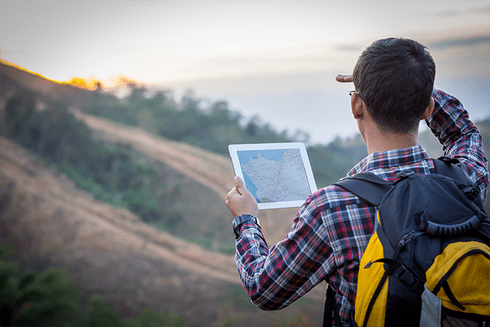 A boy looking at the map - Inter American Development Bank - Disaster Risk Management