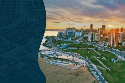 Panoramic view of coastal city with sunset and sea in the background - Inter American Development Bank - Urban Development and Housing