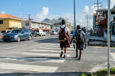 Kids walking on a street with the daylight - Inter American Development Bank - Public Sector