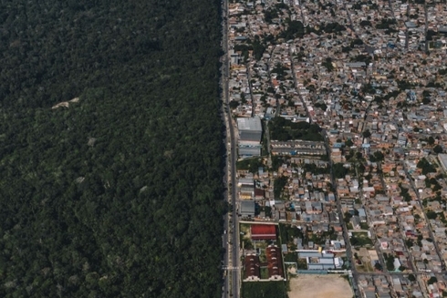 View from above of a forest and Manaus city - Inter American Development Bank - IDB