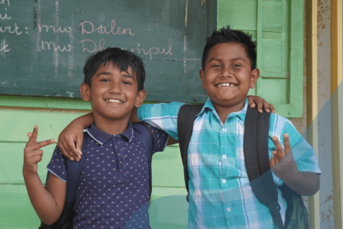 Boys smiling and huging - Education - Inter American Development Bank - IDB