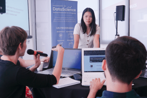 Participants collaborating in a data science training and learning session IDB
