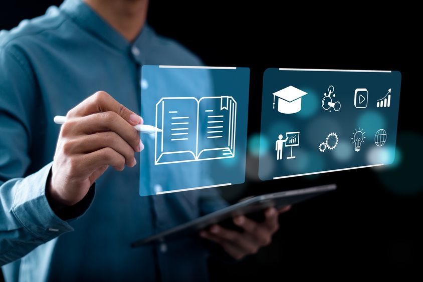 Hand touching a digital screen - Education - Inter American Development Bank - IDB