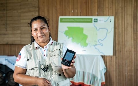 woman holding cellphone app